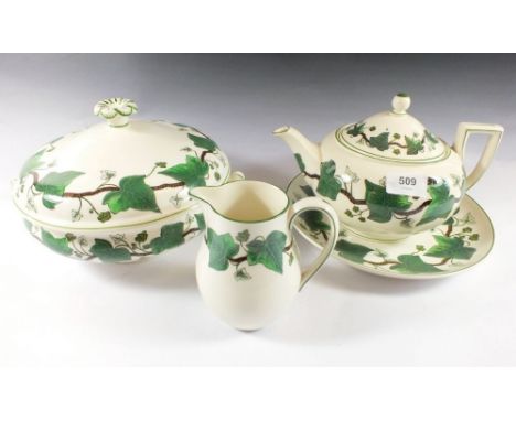 A Wedgwood 'Napoleon Ivy' dinner and tea service comprising: six dinner plates, six plates, six bowls, two tureens, gravy, te
