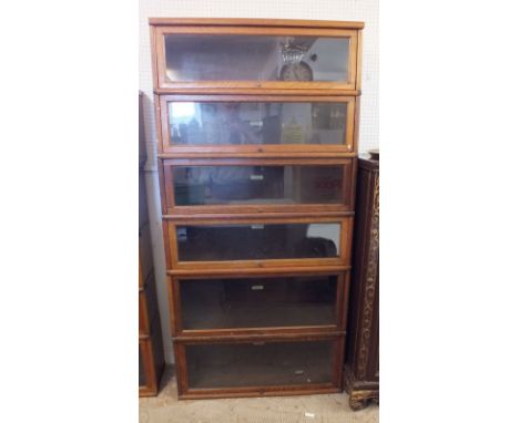 A Globe Wernicke oak six section bookcase including two deeper sections at base, 183cm tall x 86.5 wide x 30cm deep 