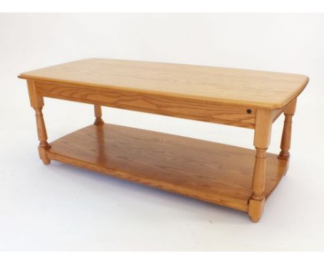 An Ercol light elm two tier coffee table, 114cm wide x 51cm deep