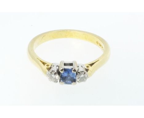 An 18ct gold Art Deco style ring set with central sapphire and flanking diamonds, size O 1/2, 4g 