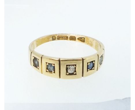 A Victorian 15 carat gold ring set chip diamond flanked by two sapphires and two white stones - size O 