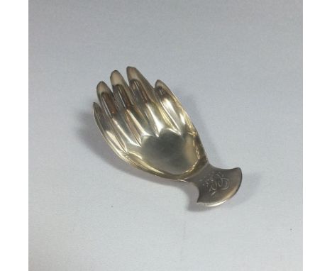 A Georgian silver novelty caddy spoon modelled as a hand, London 1808 