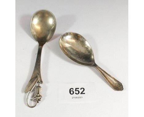 A Danish silver Art Nouveau caddy spoon and a silver plated example 