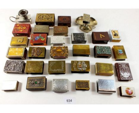 A selection of antique and vintage matchbox holders and covers