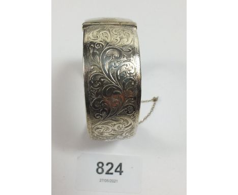 A silver engraved bangle 