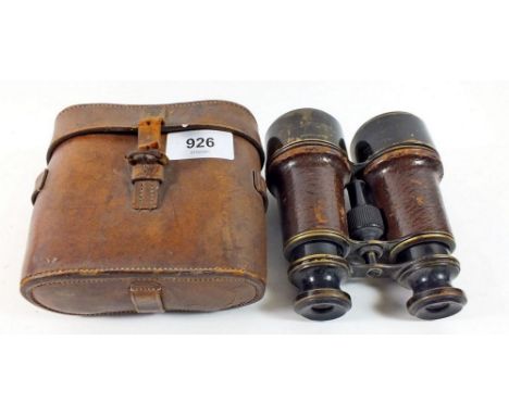A pair of vintage binoculars in leather case 