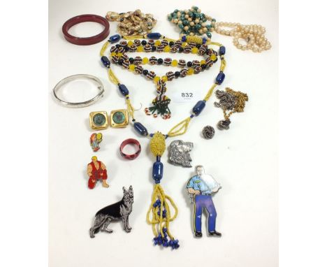 Two vintage beaded necklaces, silver bracelet, dog brooch and various badges 