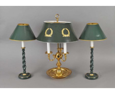 A reproduction three light brass desk lamp, 62 cm high, together with a pair of painted barley twist candlesticks, 43 cm high