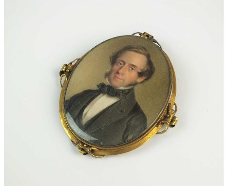 An oval portrait miniature of a gentleman, within yellow metal brooch mount, not signed, 75mm x 66mm