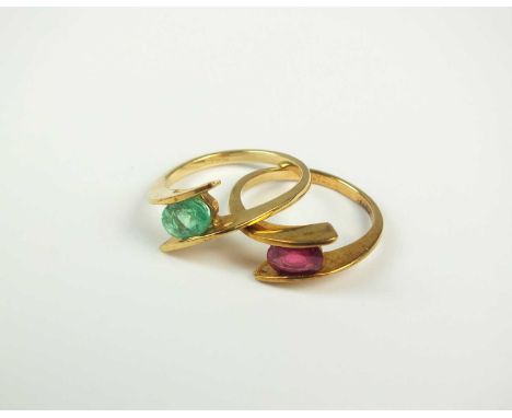 A 9ct gold single stone ruby ring, together with a matching 9ct gold emerald ring, both size N, total weight approx 5.3g (2)