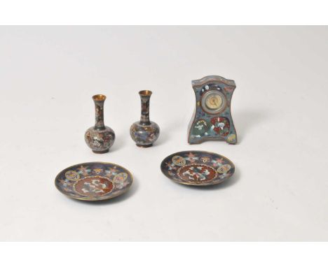 A Chinese cloisonné enamel cased mantle clock, the blue field decorated with shell shaped vignettes decorated with flowers an