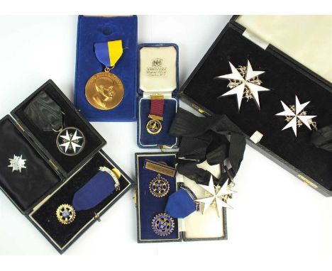 A cased Order of St John badge and medal, together with two further order of St John medals, a 9ct gold and enamel Rotary Clu