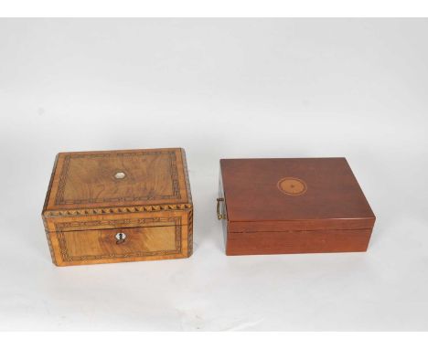 A Victorian parquetry walnut writing slope, the hinged cover opening to reveal a divisional interior, with inkwell, several p