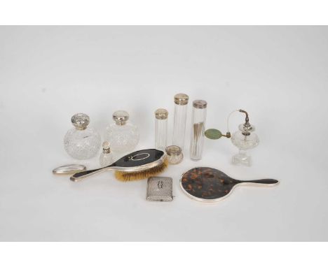 A collection of six silver topped glass dressing table jars, together with a silver collared perfume bottle, a silver and tor