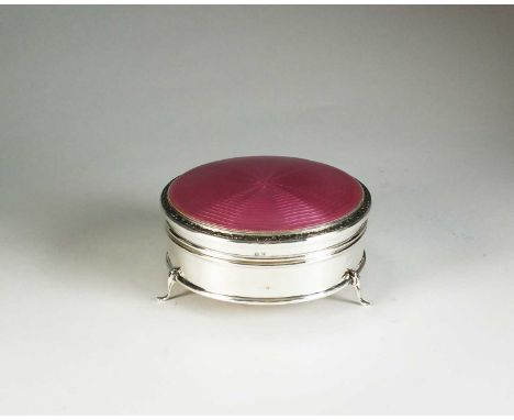 A silver and enamel trinket box, makers mark rubbed, Birmingham 1927, of circular form with pink guilloche enamel hinged cove