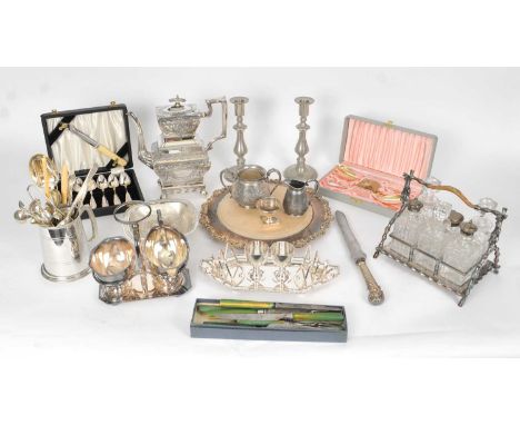 A collection of silver plated wares, to include; a coffee pot, wood mounted cheese board, egg cup stand, flatware, cruet stan