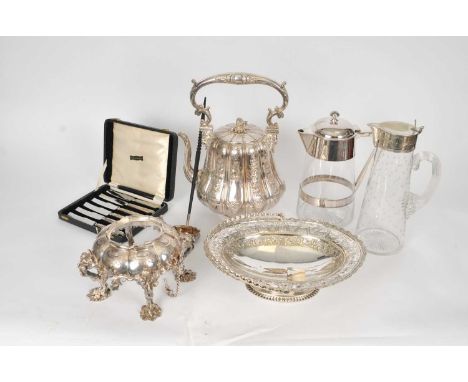A large Elkington &amp; Co silver plated kettle on stand, together with two silver plated mounted glass jugs, a silver plated