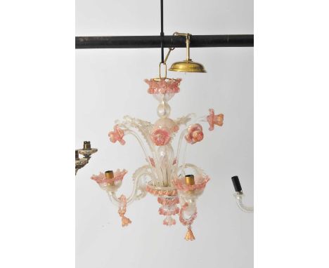 A cranberry tinted three-light Venetian glass chandelier.