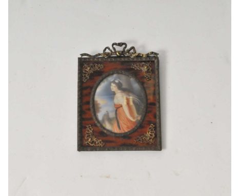 A 19th century oval tortoiseshell snuff box with brass inlay together with an oval portrait of a young girl and a dog in simu