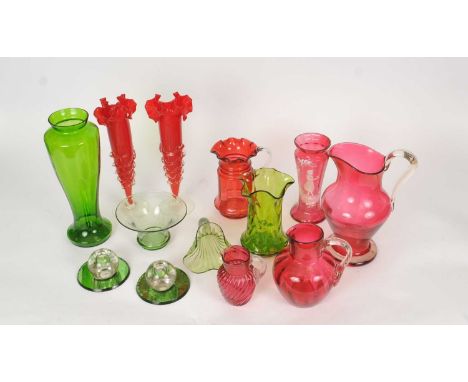 A collection of Victorian and early 20th-century decorative glassware, including five ruby glass jugs, 'Mary Gregory' style v