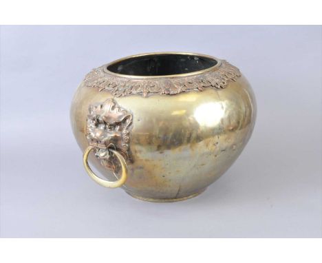 A very large Chinese brass twin-handled jardinière, late 19th / early 20th century, of tapering bulbous form, decorated with 