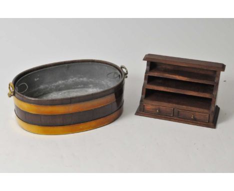 A large mid / late 19th century coopered mahogany planter, with hinged loop handles, with original liner, 20 cm high 55 x 37 