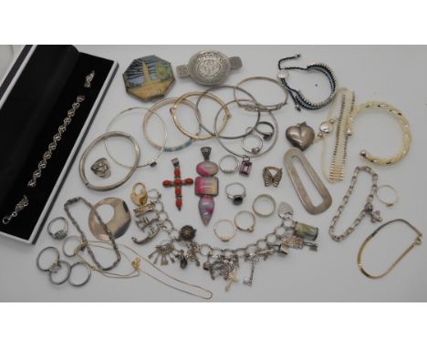 A silver charm bracelet, a compact depicting The Empire Exhibition 1938, silver bangles and other items Condition Report: Not