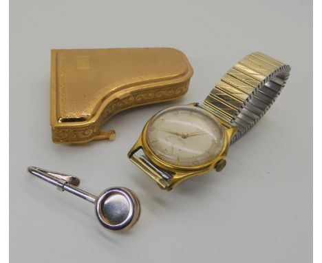 A piano shaped compact by Pygmalion, a silver handbag hook (for a table cloth) and a gents Rotary watch Condition Report: Not