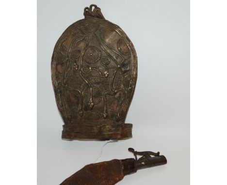 A metal plaque decorated with serpents and a powder flask (2) Condition Report: Available upon request