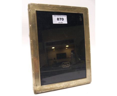A sterling silver mounted photo frame inscribed " 26th July 2008 " 21.5 cm x 16 cm aperture 18cm x 13 cm Condition Report: Av