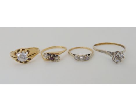 An 18ct gold cz solitaire ring, size Y1/2, weight 1.8gms, a 9ct ruby and diamond retro three stone ring size O1/2, a 9ct diam