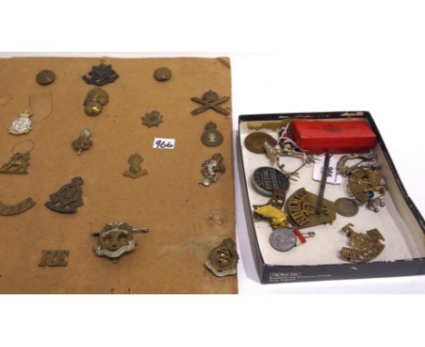A lot comprising assorted military badges &amp; pips mounted on three cards with a pair of epaulettes, buttons etc. in two bo