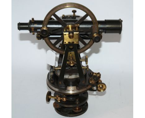 A theodolite by J Brown, Glasgow with compass and a red painted desk lamp (2) Condition Report: Available upon request