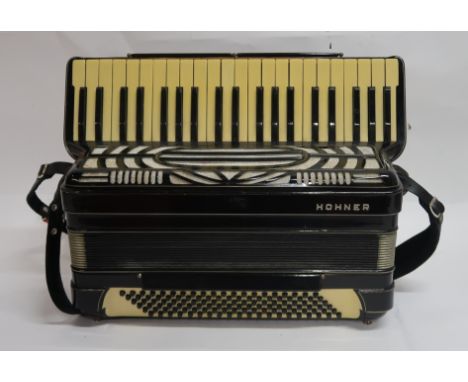 A 41 key 120 bass Hohner piano accordion in black with case Condition Report: Available upon request