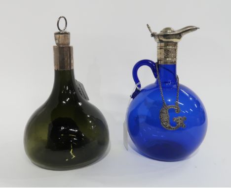 A green onion bottle decanter with silver plated mount and a blue glass flask with silver plated mounts Condition Report: Gre