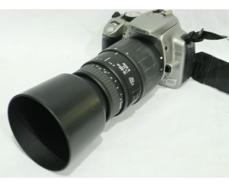 Canon EOS 350D digital camera with a Sigma 70-300mm Telephoto lens. P&amp;P Group 2 (£18+VAT for the first lot and £3+VAT for