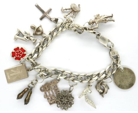 925 silver charm bracelet with thirteen charms, L: 20 cm, combined 45g. P&amp;P Group 1 (£14+VAT for the first lot and £1+VAT