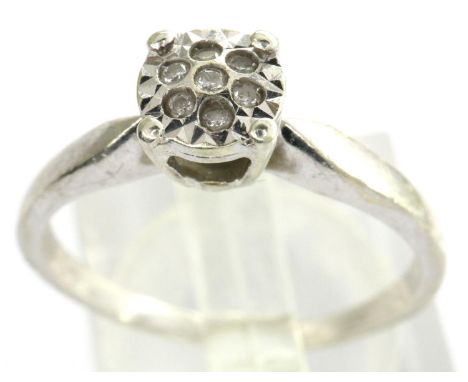 9ct white gold ring set with seven diamonds, size O/P, 2.1g. P&amp;P Group 1 (£14+VAT for the first lot and £1+VAT for subseq