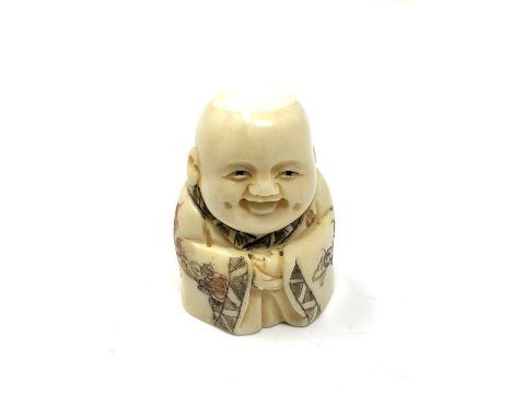 A carved bone netsuke - Happy Buddha figure