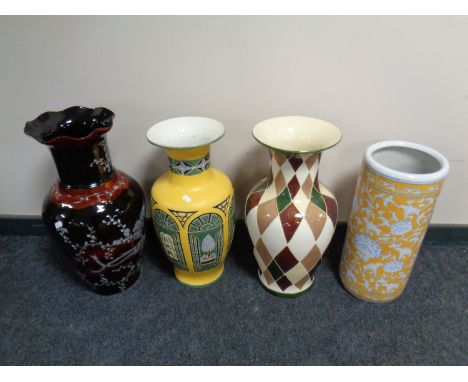 An oriental style vase with faux mother of pearl inlay together with two further glazed pottery vases and a stick stand 
