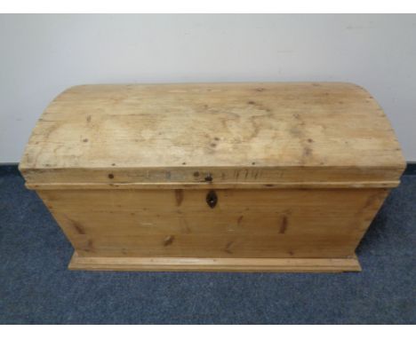 An antique pine dome topped trunk 