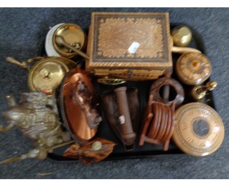 A tray of treen trinket boxes and lidded dishes, wooden darning tool, brass kettle, cast iron figure of a viking, flat iron e