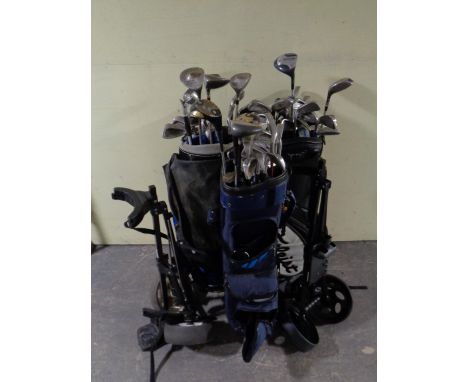 Two golf bags of a large quantity of drivers and irons to include Wilson, Dunlop, Killer Whale, together with two folding gol