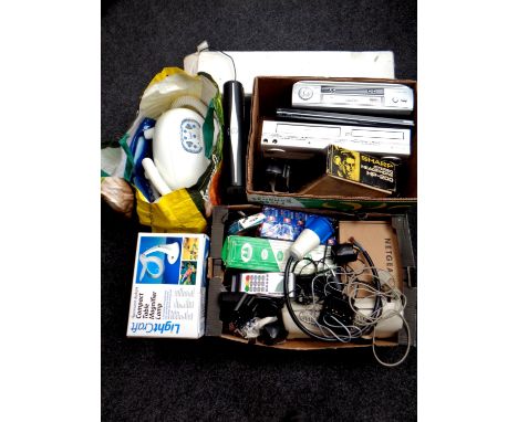 A quantity of miscellaneous electricals to include massage machine, DVD VCR, DVD players, table magnifying lamp, Sky box etc 