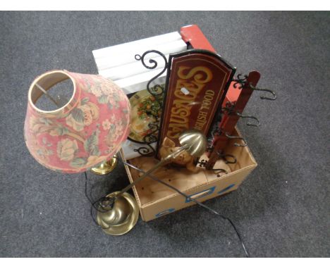 A box containing new wall clocks, angle poise lamp, brass table lamp with shade, together with a cast metal coat rack  