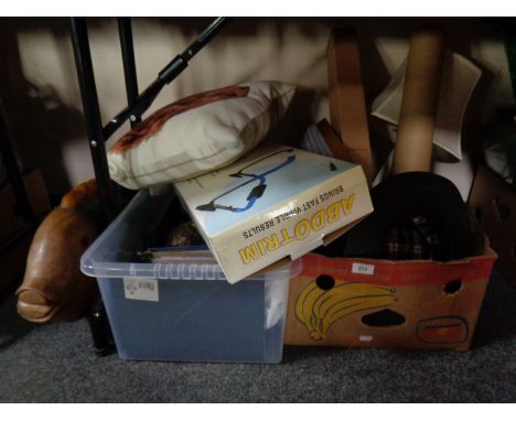 A box and a crate of miscellany to include picture frames, cushions, flask, flexi light, lap tray, table lamp, together with 