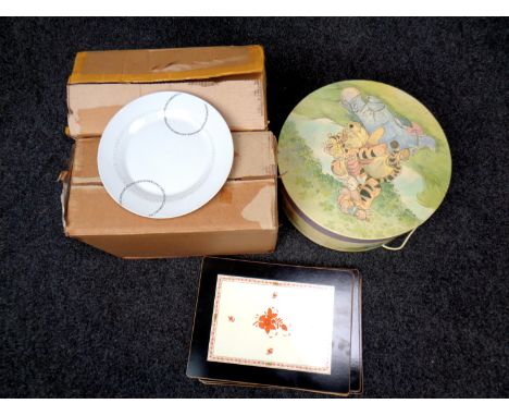 Two boxes containing ceramic dinner services together with a set of place mats and a Whinnie the Pooh hat box 