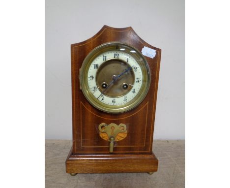 An Edwardian inlaid mahogany eight day mantel clock with brass and enamelled dial