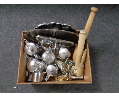 A box containing a quantity of stainless steel tea ware, napkin rings, serving trays together with wooden rolling pin etc 