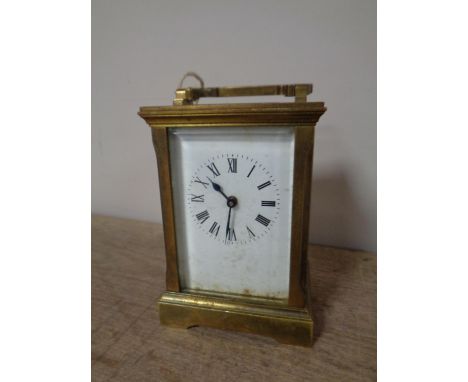 A brass cased carriage clock with key 
